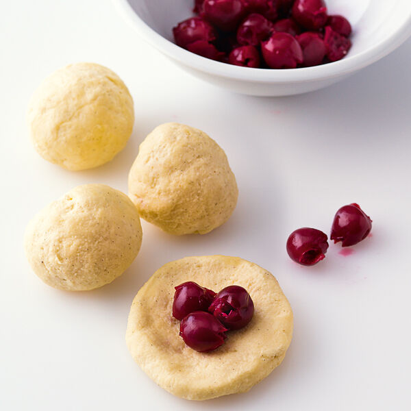 Topfen-Kirsch-Knödel mit Nougatsauce Rezept | Küchengötter Topfen-Kirsch-Knödel mit Nougatsauce Rezept | Küchengötter